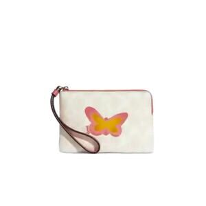 COACH BUTTERFLY CORNER ZIP WRISTLET IN SIGNATURE CANVAS & SMOOTH LEATHER